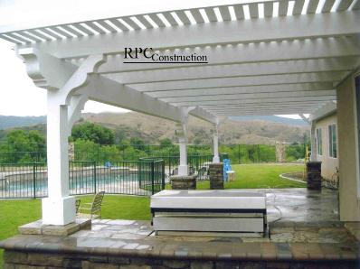 Wood Beam Style Lattice Patio Cover with Stone Columns and Built In BBQ Island